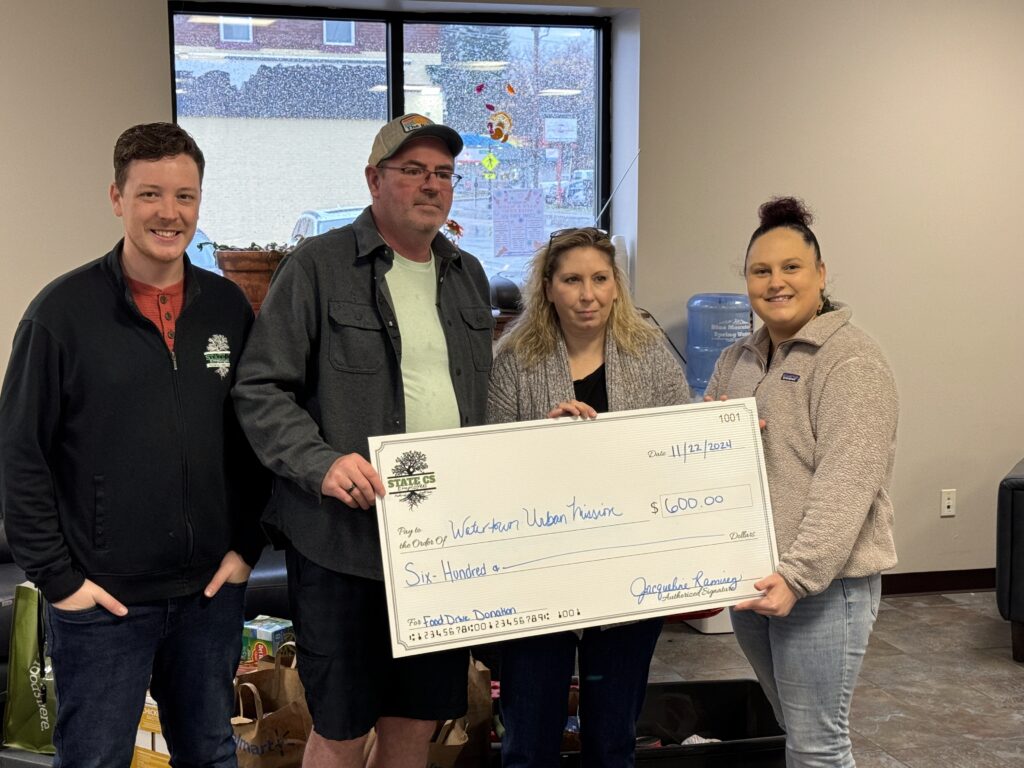 State CS Presenting check to Watertown Urban Mission